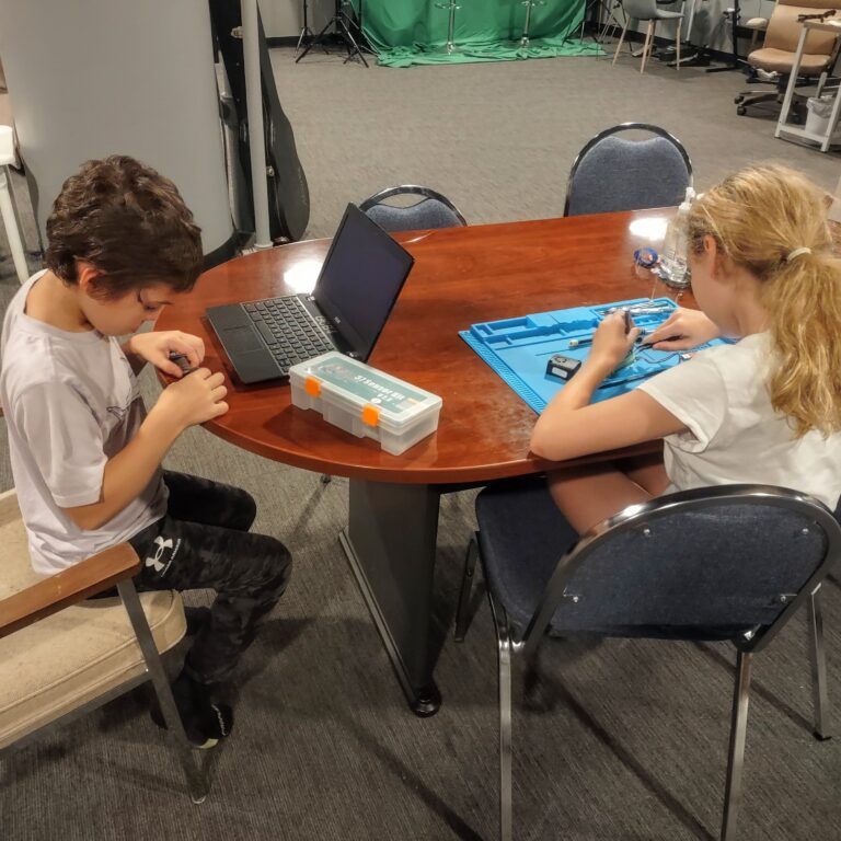 TECH Recruits members explore technology with an Arduino sensor kit.